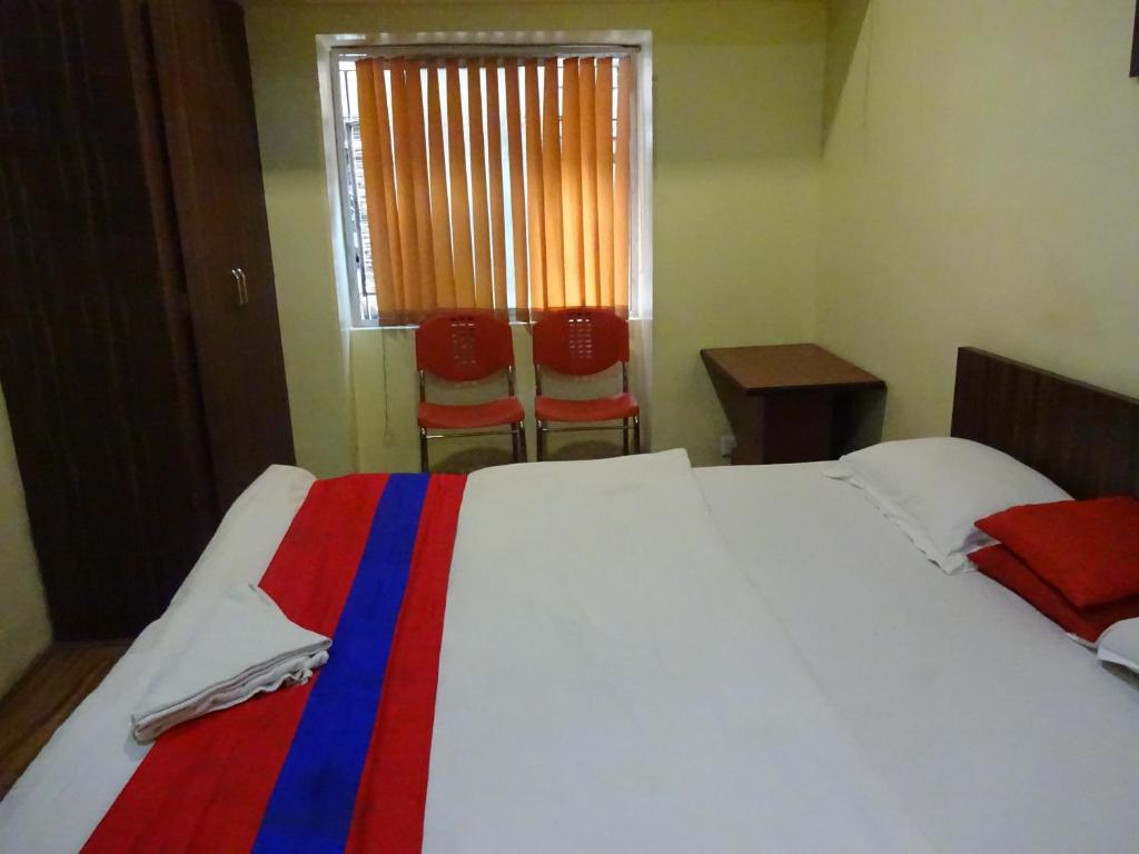 Postel nebo postele na pokoji v ubytování Monovilla Inn