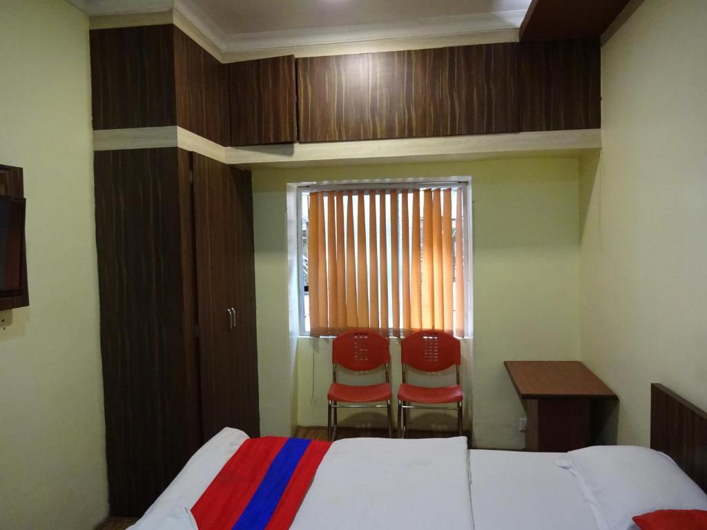 Postel nebo postele na pokoji v ubytování Monovilla Inn