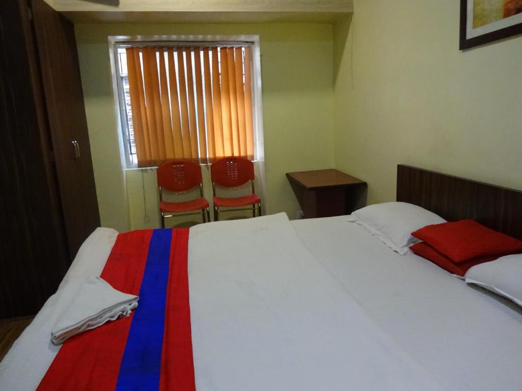 Postel nebo postele na pokoji v ubytování Monovilla Inn