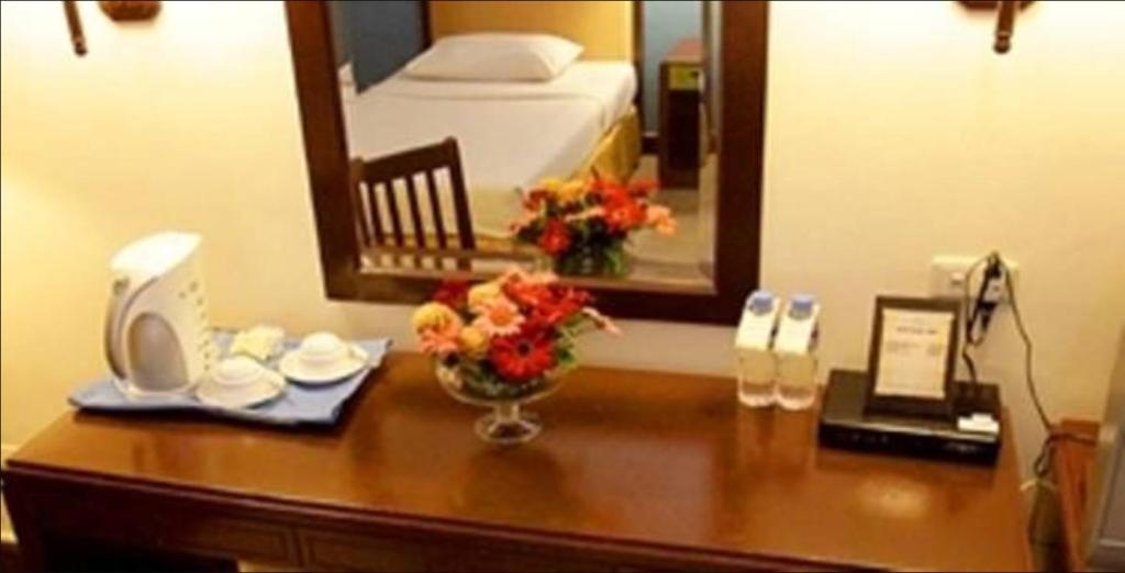 Postel nebo postele na pokoji v ubytování The Royal Mandaya Hotel