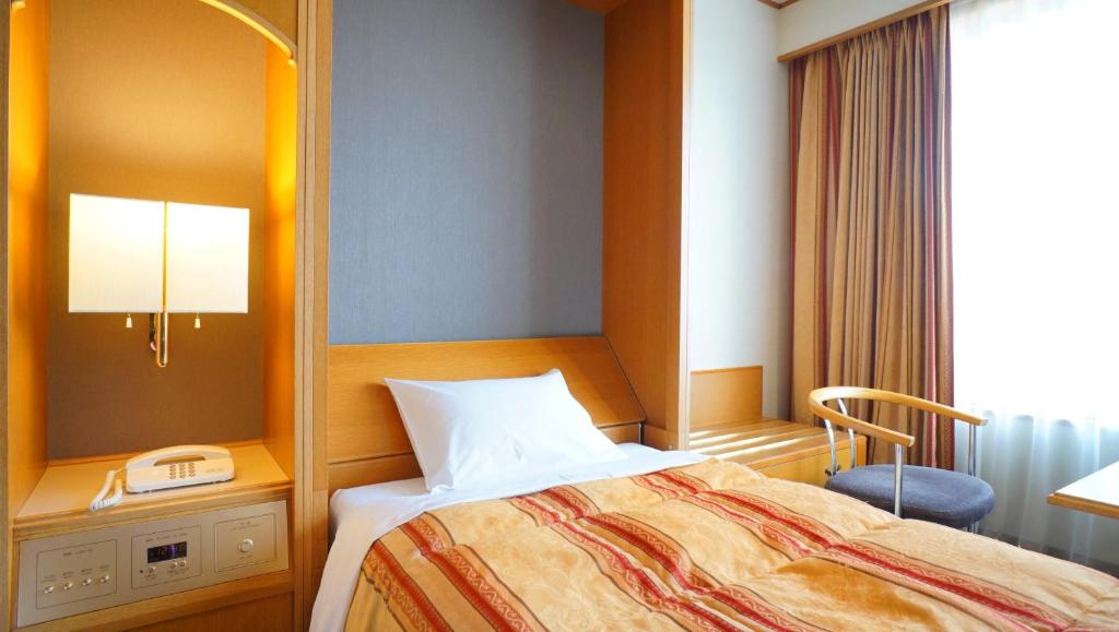 Postel nebo postele na pokoji v ubytování Hotel Laforet Nasu
