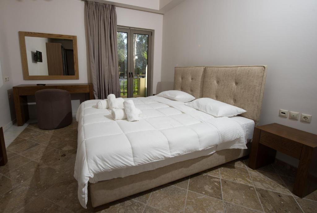 Posteľ alebo postele v izbe v ubytovaní Corali Resort