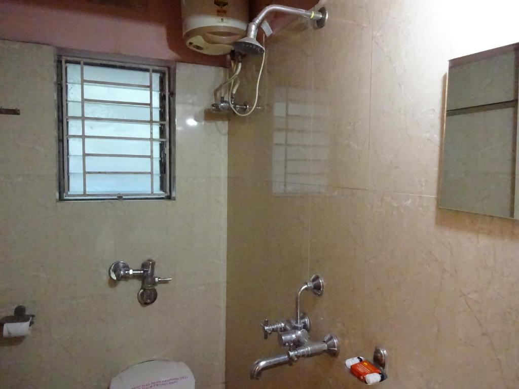 Koupelna v ubytování Hotel Avisha