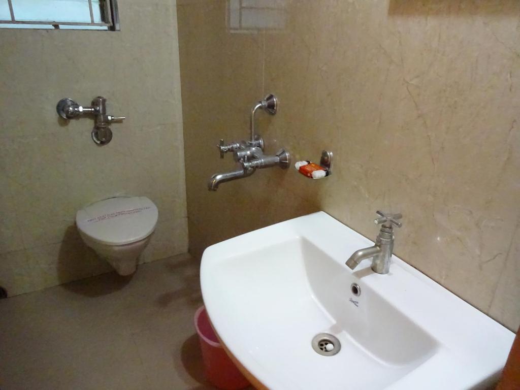 Koupelna v ubytování Hotel Avisha