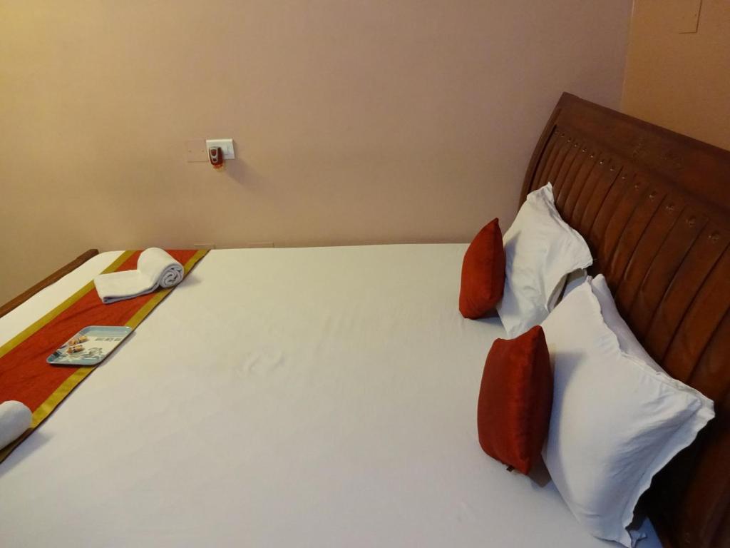 Postel nebo postele na pokoji v ubytování Hotel Avisha