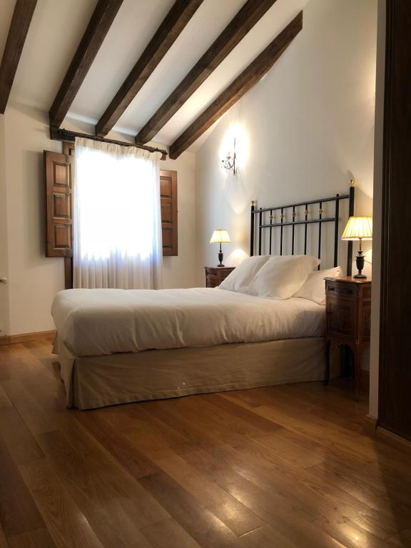 En eller flere senge i et værelse på Casa Rural La Picota