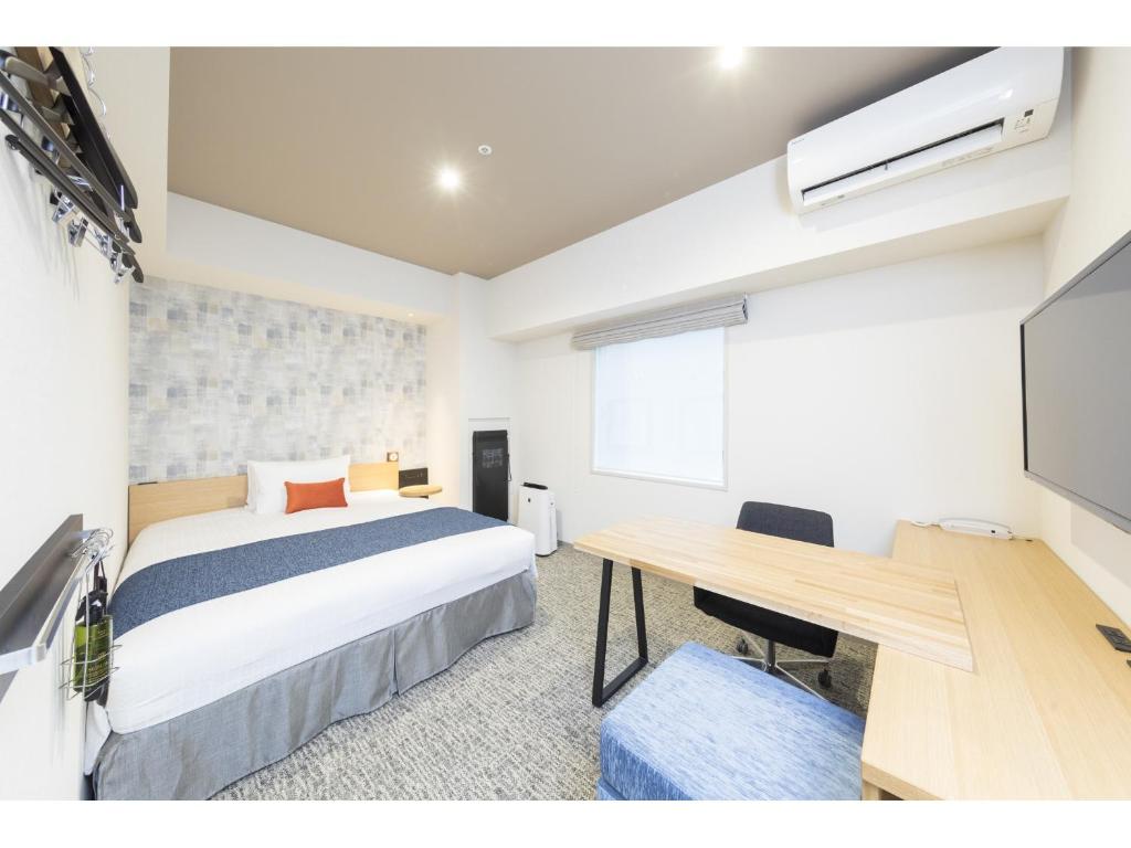 Postel nebo postele na pokoji v ubytování Tokyu Stay Takanawa Shinagawa Area