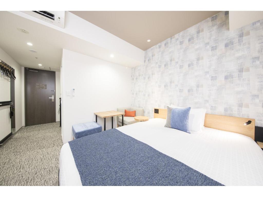 Postel nebo postele na pokoji v ubytování Tokyu Stay Takanawa Shinagawa Area