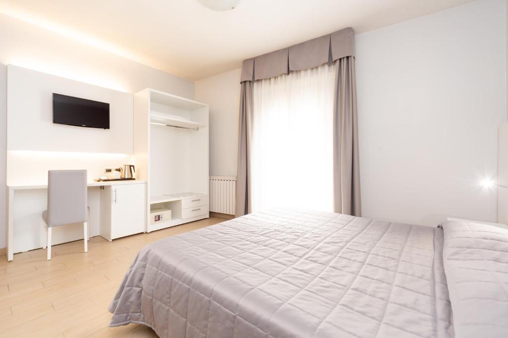 Postel nebo postele na pokoji v ubytování Hotel University