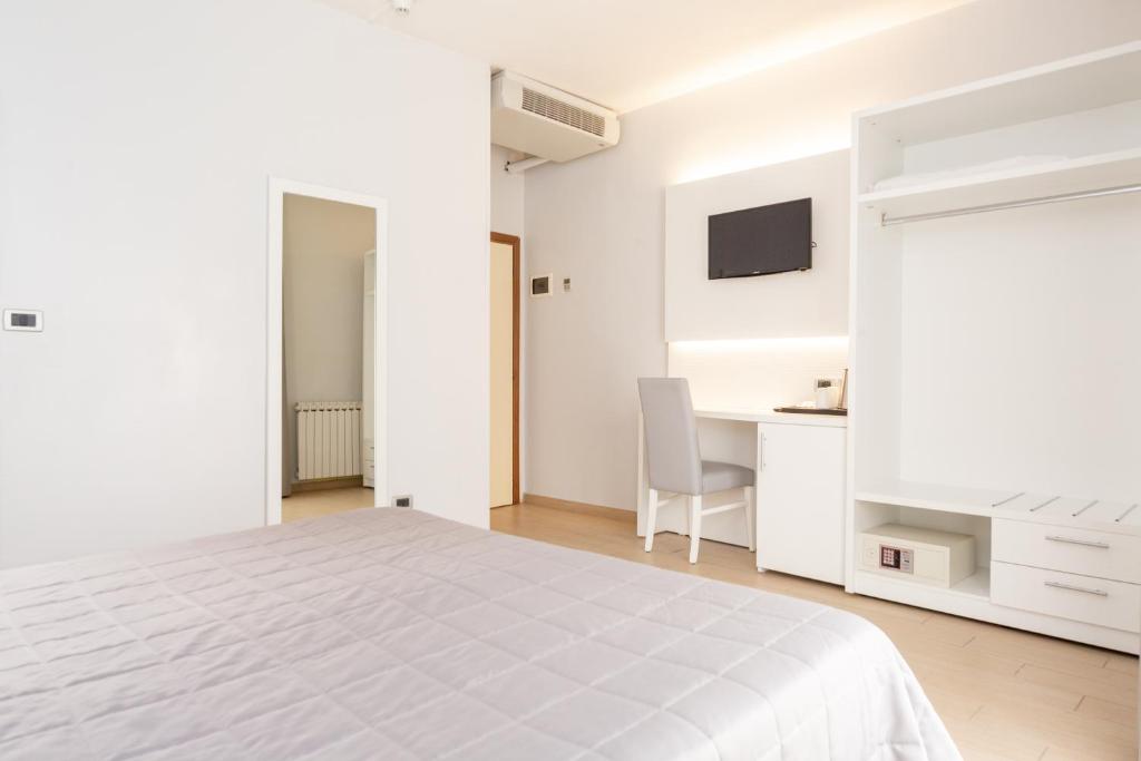 Postel nebo postele na pokoji v ubytování Hotel University