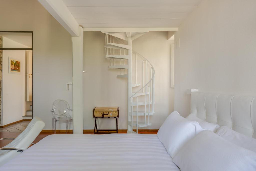 Posteľ alebo postele v izbe v ubytovaní Villa I Barronci Resort & Spa
