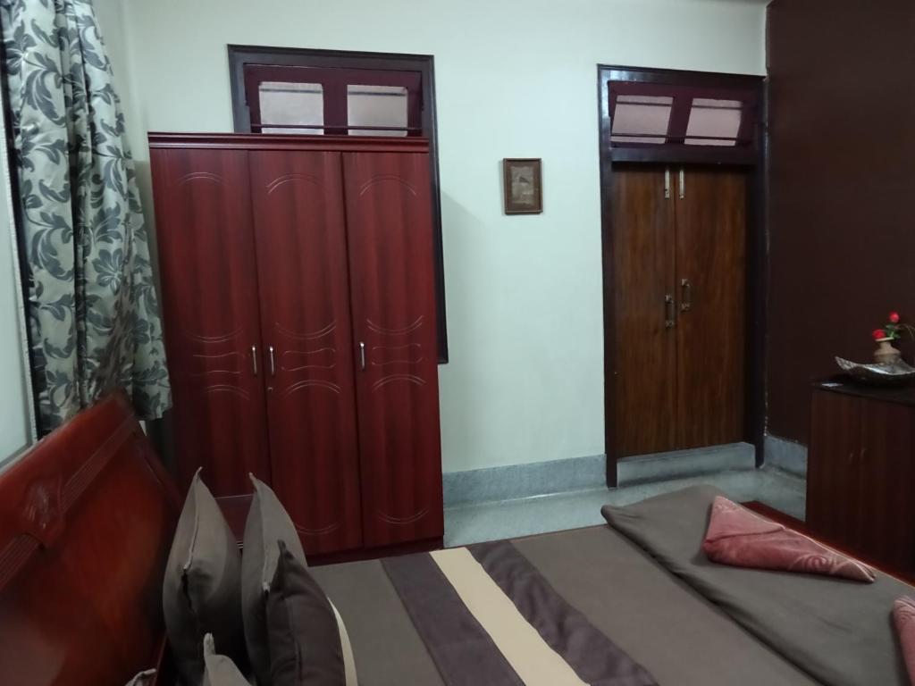 Postel nebo postele na pokoji v ubytování The Kei Suites