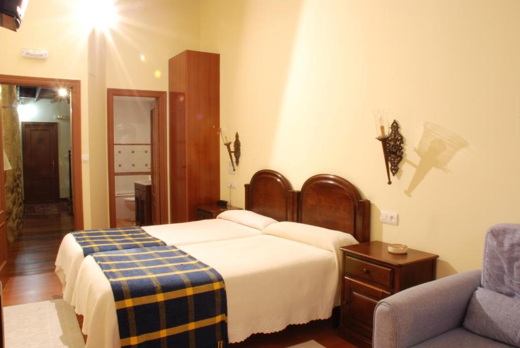 Cama o camas de una habitación en Hotel O Portelo Rural