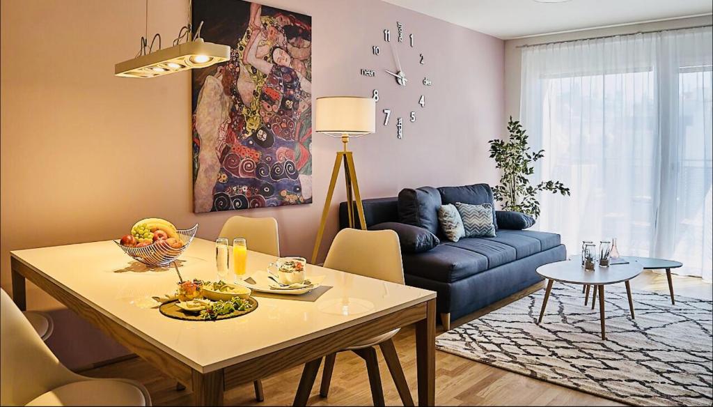 a living room with a table and a couch at Best Place Apartments Vienna in Vienna