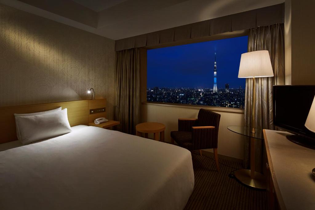 Postel nebo postele na pokoji v ubytování Tobu Hotel Levant Tokyo