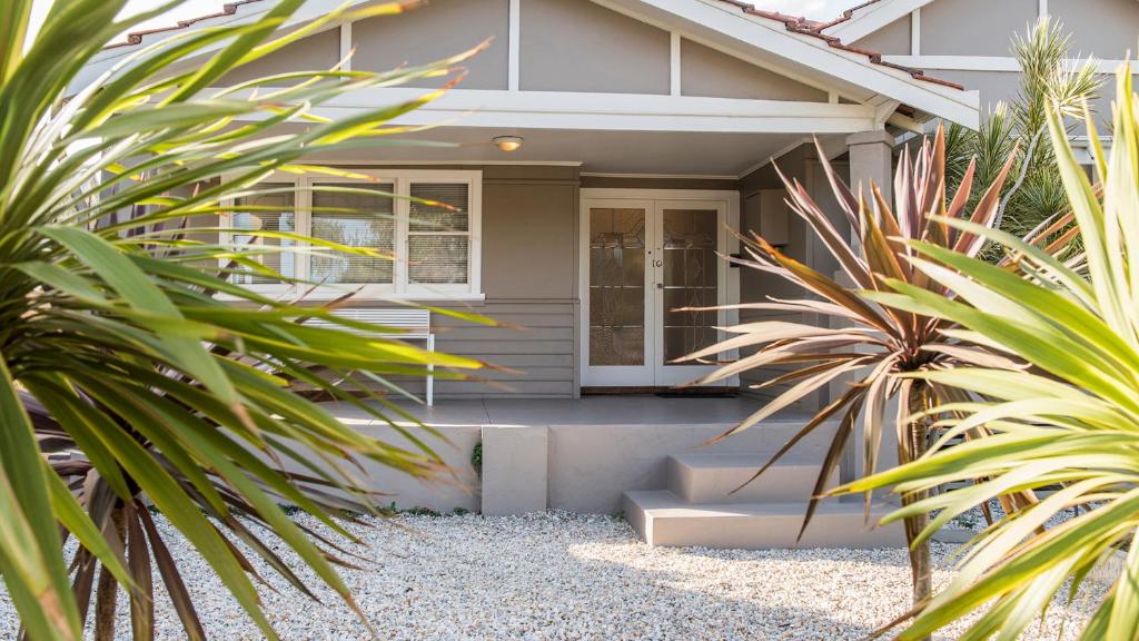 a house with some plants in front of it at Leisurely Manor - spacious three bedroom home in Fremantle in Fremantle
