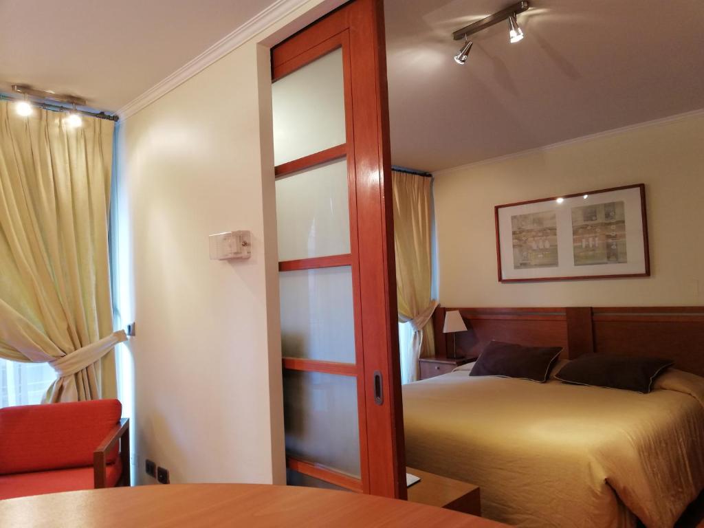 Postel nebo postele na pokoji v ubytování Andes Suites