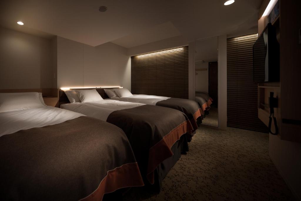 Postel nebo postele na pokoji v ubytování Nest Hotel Tokyo Hanzomon