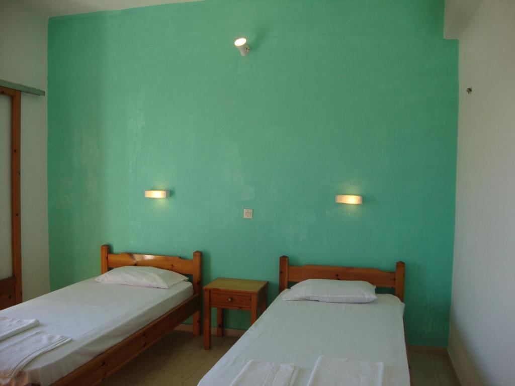 A bed or beds in a room at Alex Apartments