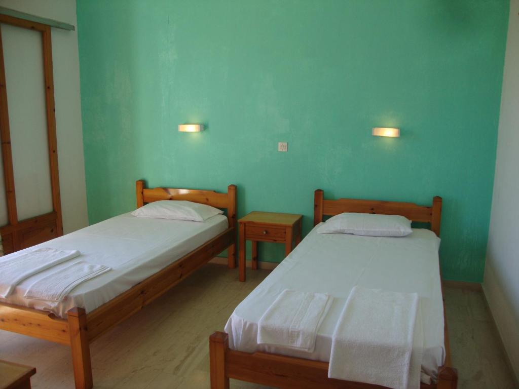 A bed or beds in a room at Alex Apartments