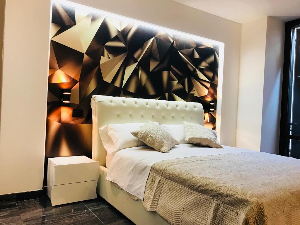 Een bed of bedden in een kamer bij Loft Sirmione