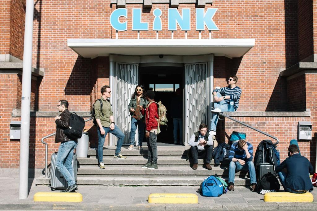 a group of people standing outside of a building at ClinkNOORD Hostel in Amsterdam