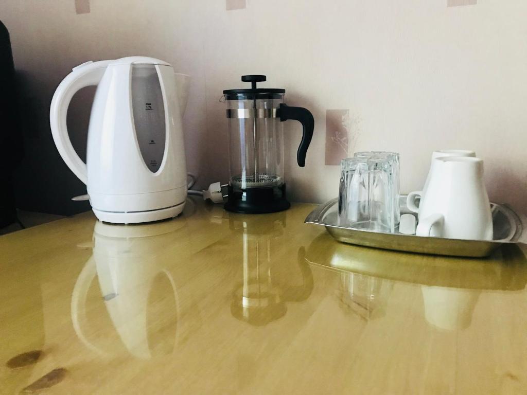 Příslušenství pro přípravu čaje a kávy v ubytování Savan House "Easy Kaunas"