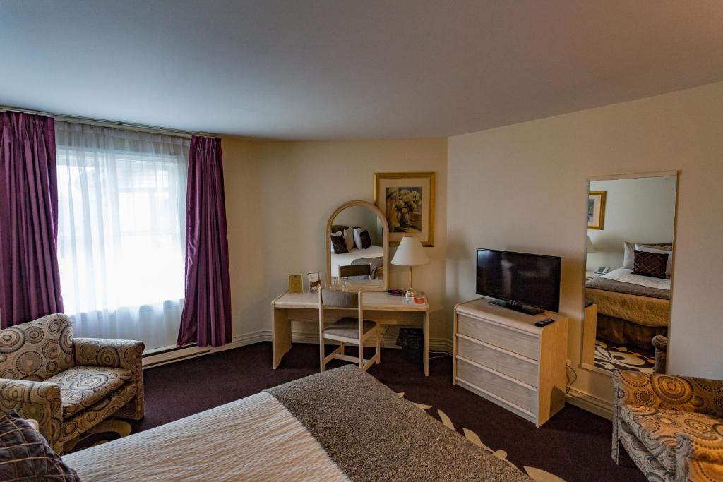 TV a/nebo společenská místnost v ubytování Airport Hotel Mara
