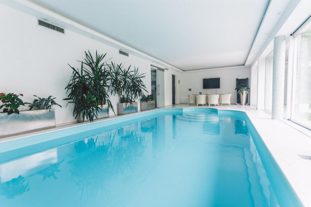 a swimming pool with blue water in a house at Nebo in Zagreb