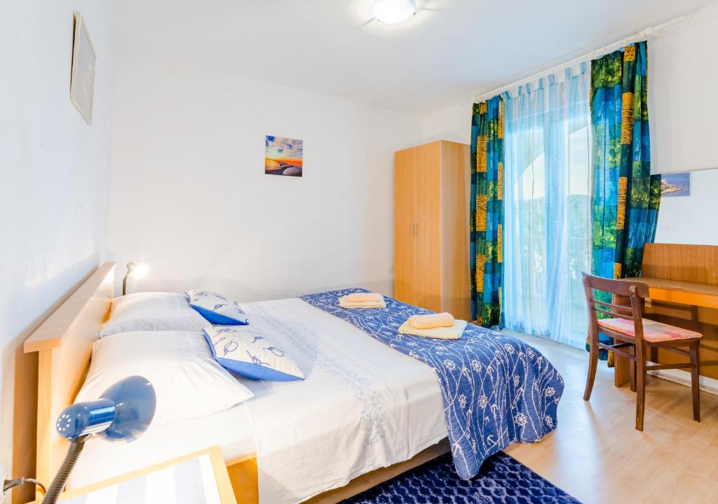 Posteľ alebo postele v izbe v ubytovaní Apartment Sea Star