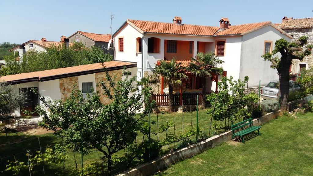 a house with a fence in front of it at Apartment Marija in Vižinada