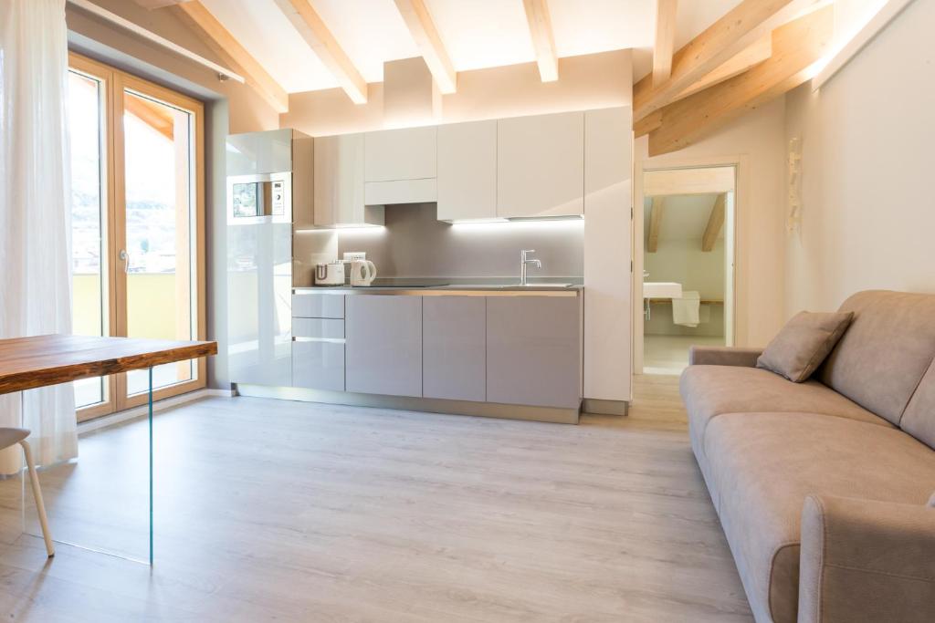 A kitchen or kitchenette at La Giostra Home Apartments