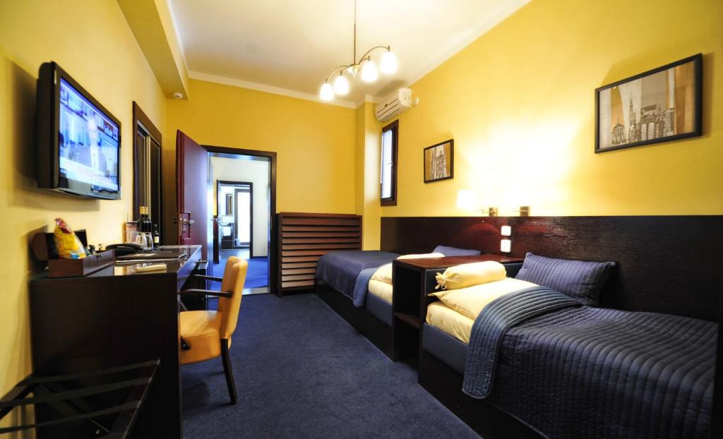 Postel nebo postele na pokoji v ubytování Hotel Arte