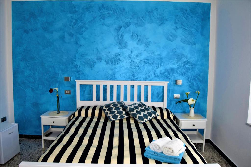 Postel nebo postele na pokoji v ubytování Levante Blu