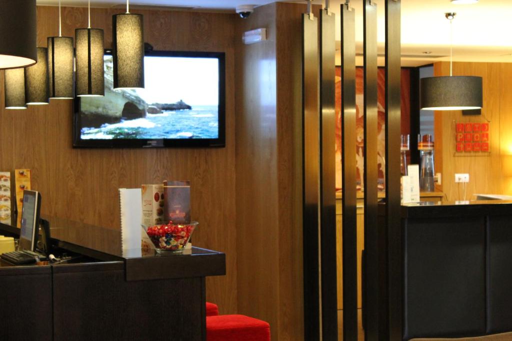TV a/nebo společenská místnost v ubytování Hotel Principe Lisboa