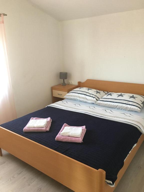 Postel nebo postele na pokoji v ubytování Beach house Korina