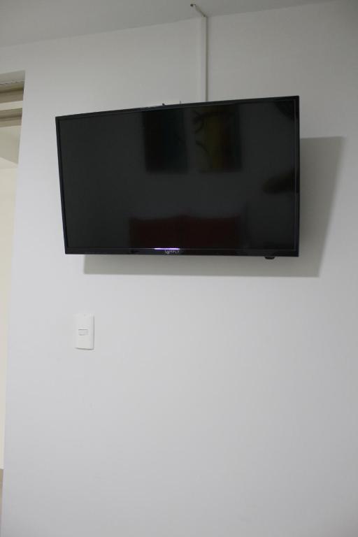 TV a/nebo společenská místnost v ubytování Hotel Pereira 421