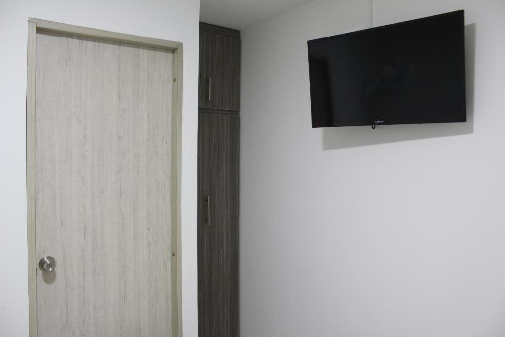 TV a/nebo společenská místnost v ubytování Hotel Pereira 421