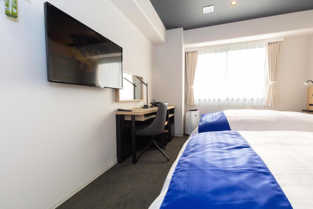 Postel nebo postele na pokoji v ubytování Ariston Hotel Kyoto Jujo