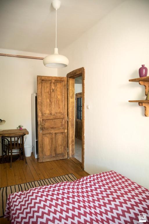 Postel nebo postele na pokoji v ubytování Liget Vendégház