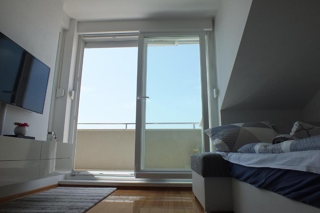 Postel nebo postele na pokoji v ubytování Apartment Silvija