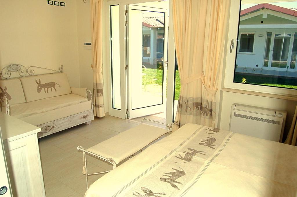 Postel nebo postele na pokoji v ubytování Hotel Budoni Beach