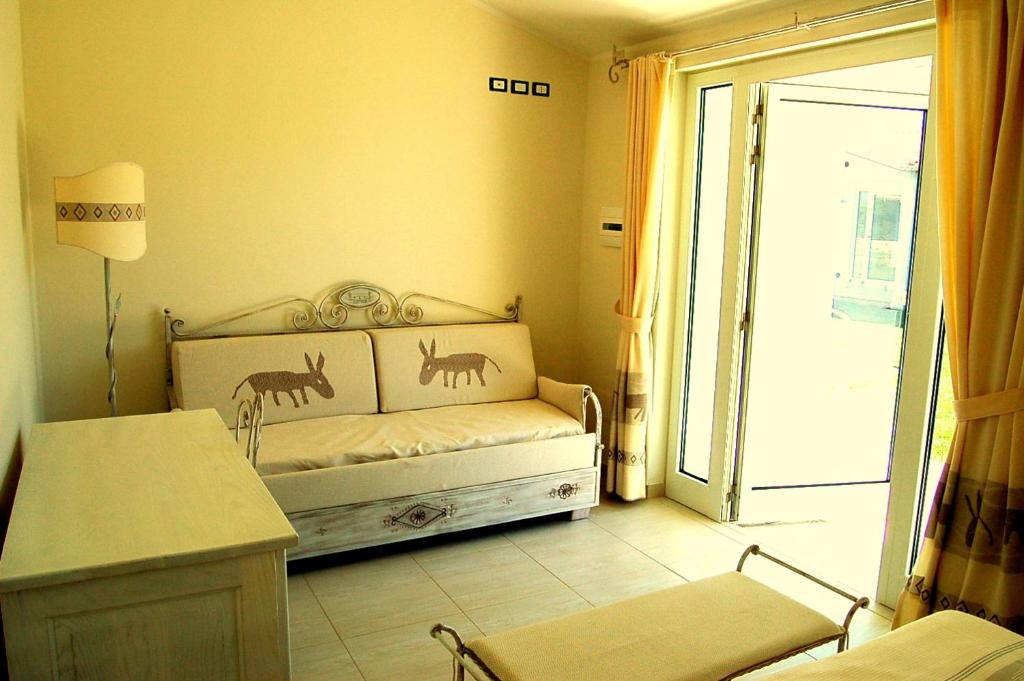 Postel nebo postele na pokoji v ubytování Hotel Budoni Beach