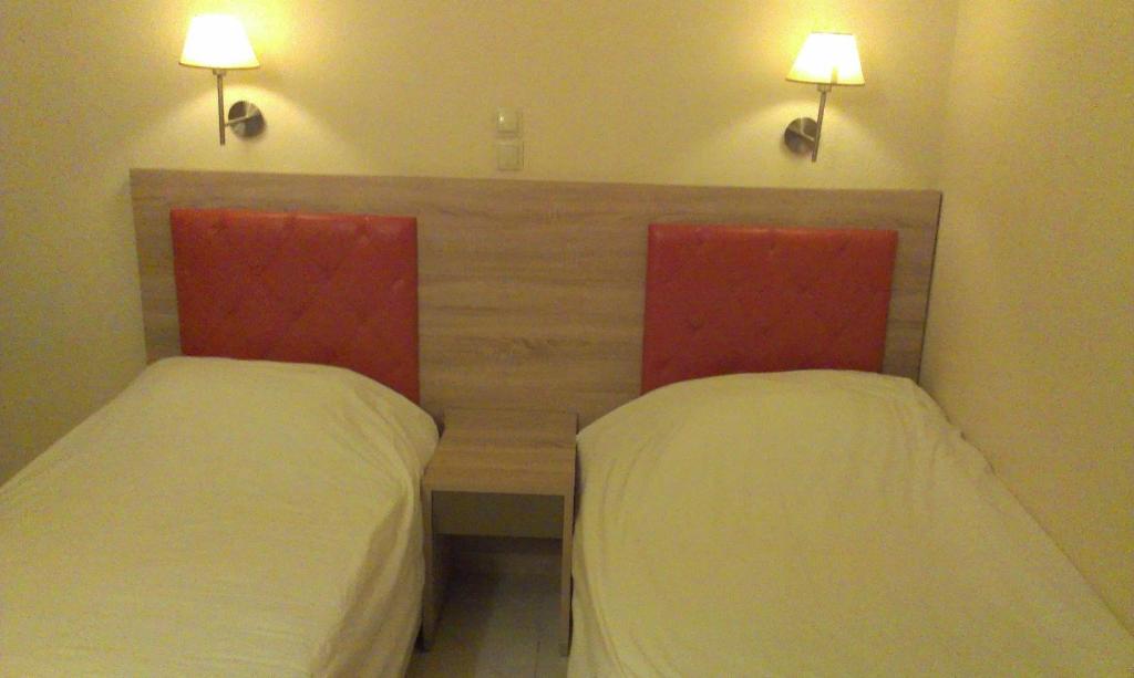 Postel nebo postele na pokoji v ubytování Makedonia Hotel
