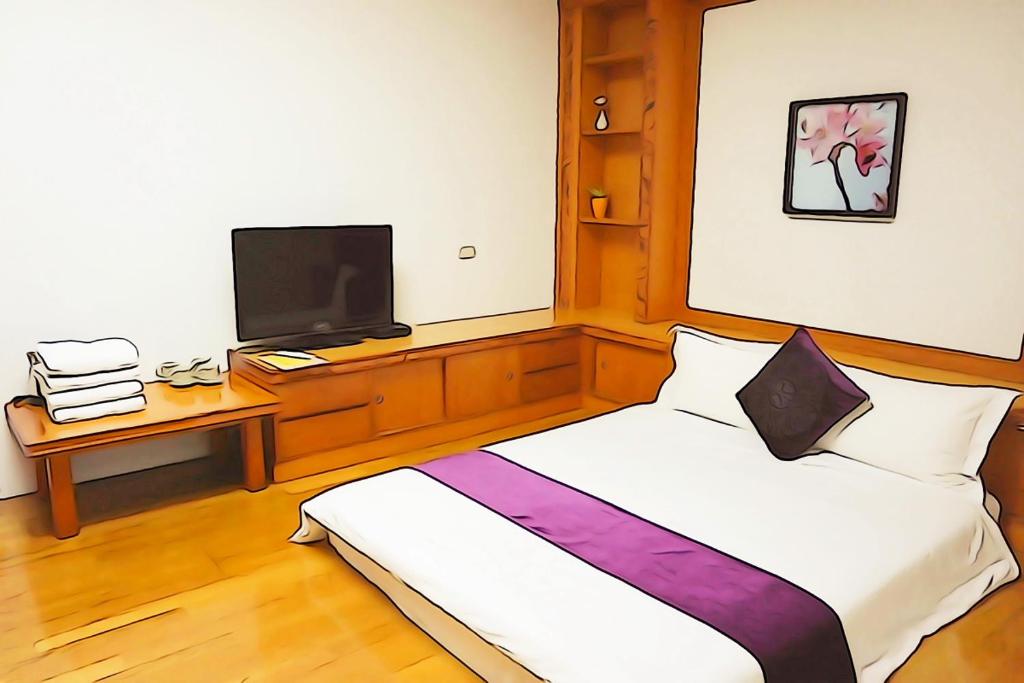 A television and/or entertainment centre at Donggang Hai-Wan Homestay
