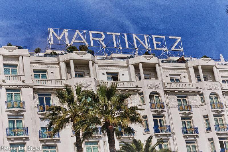 a building with a large sign on top of it at Croisette View Lux Flat Cannes in Cannes