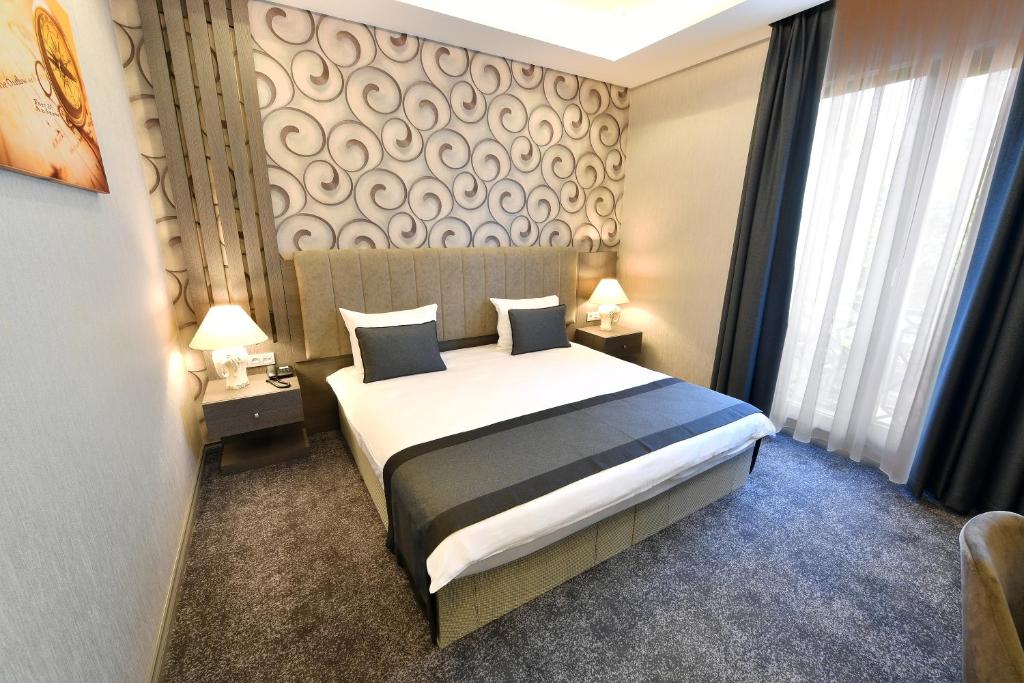 Postel nebo postele na pokoji v ubytování D'LUX BOUTİQUE HOTEL