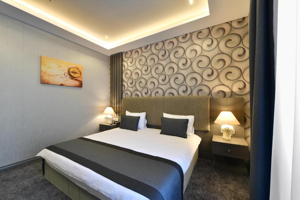 Postel nebo postele na pokoji v ubytování D'LUX BOUTİQUE HOTEL