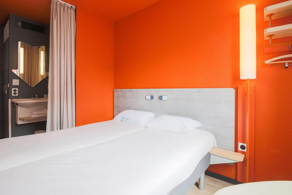 Llit o llits en una habitació de Ibis Budget Albi Centre