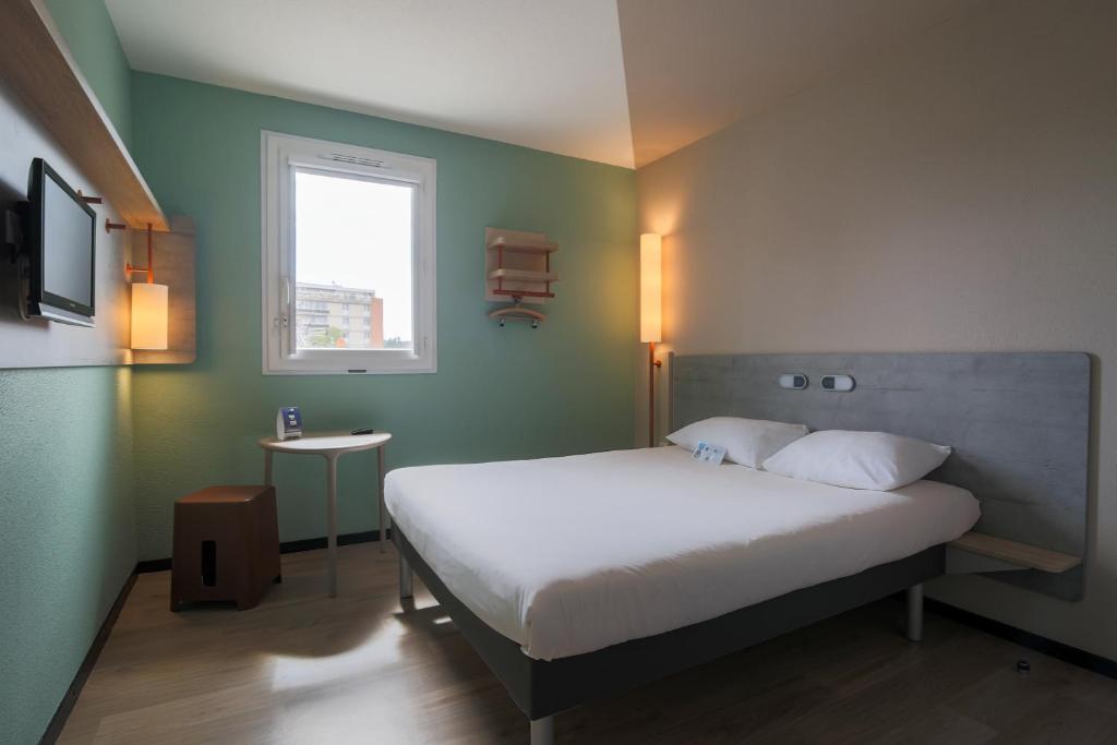 Llit o llits en una habitació de Ibis Budget Albi Centre
